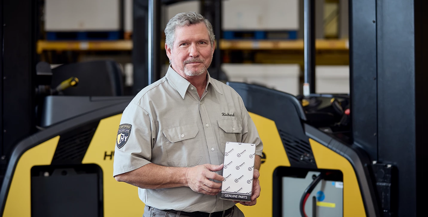 Man holding HYSource genuine parts box. 