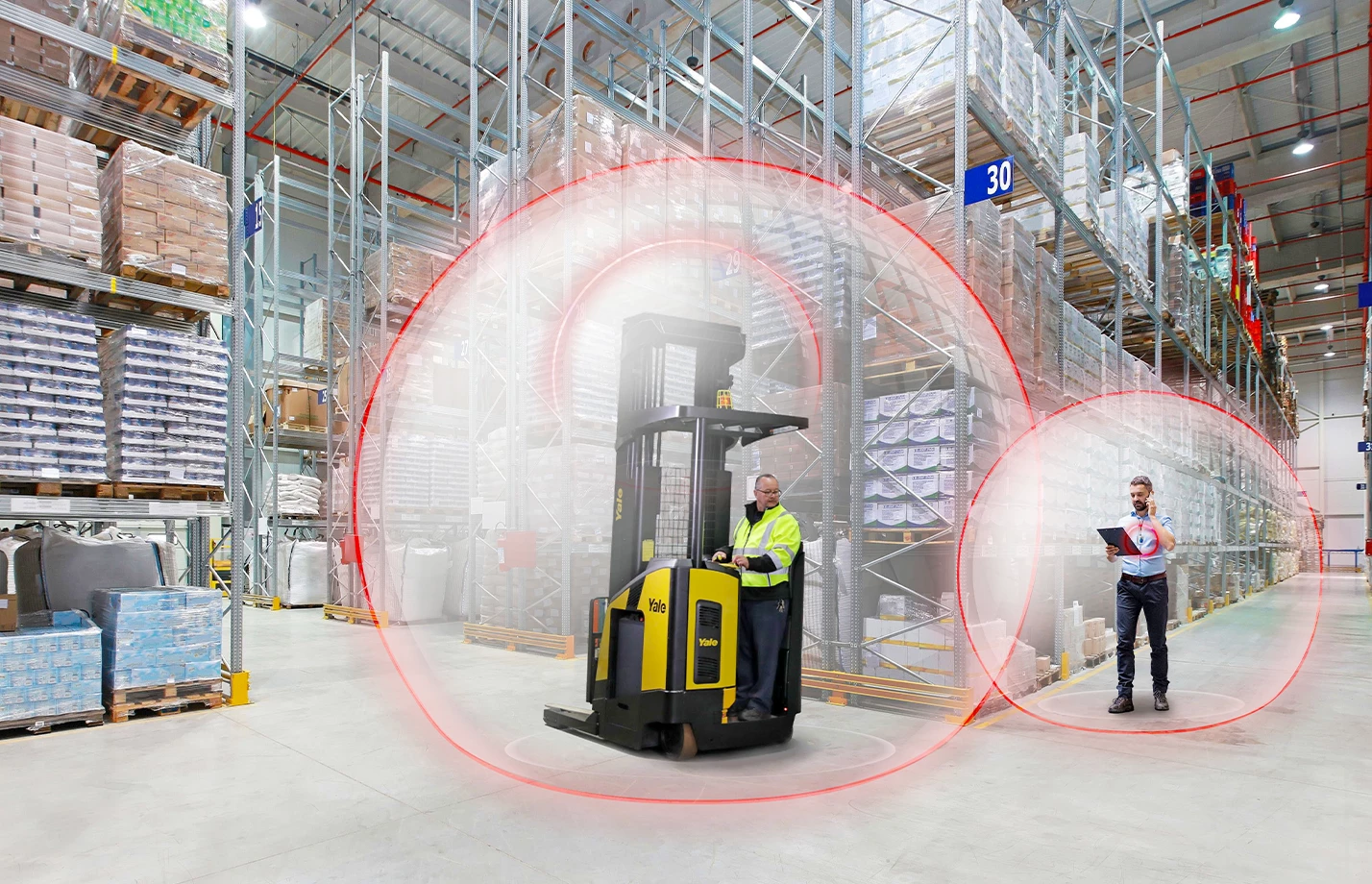 Yale reach truck with Yale Reliant operator assist system slowing as it nears pedestrian. 